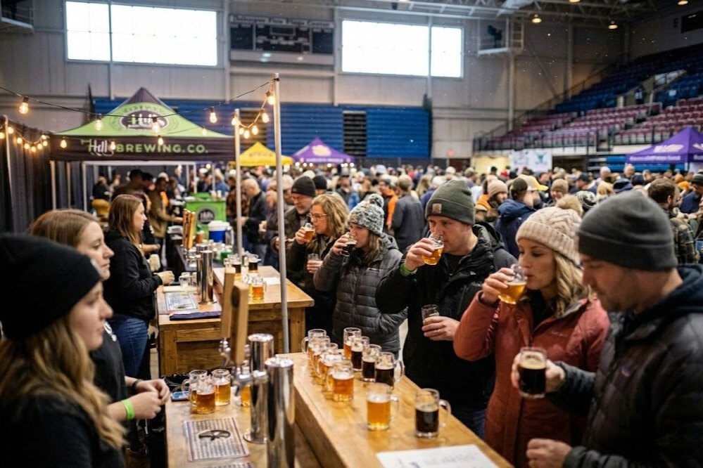 Winter beer festival at Five Flags Center Dubuque with craft beer tasting samples, brewery vendors, and attendees enjoying Iowa's premier winter brewfest